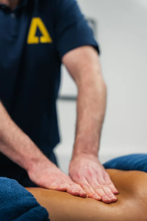 Soft tissue therapy on a client's back at Ascension