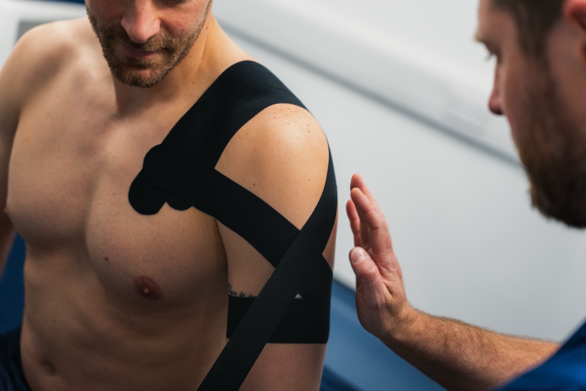 Physiotherapist applying performance taping at Ascension Physiotherapy & Performance