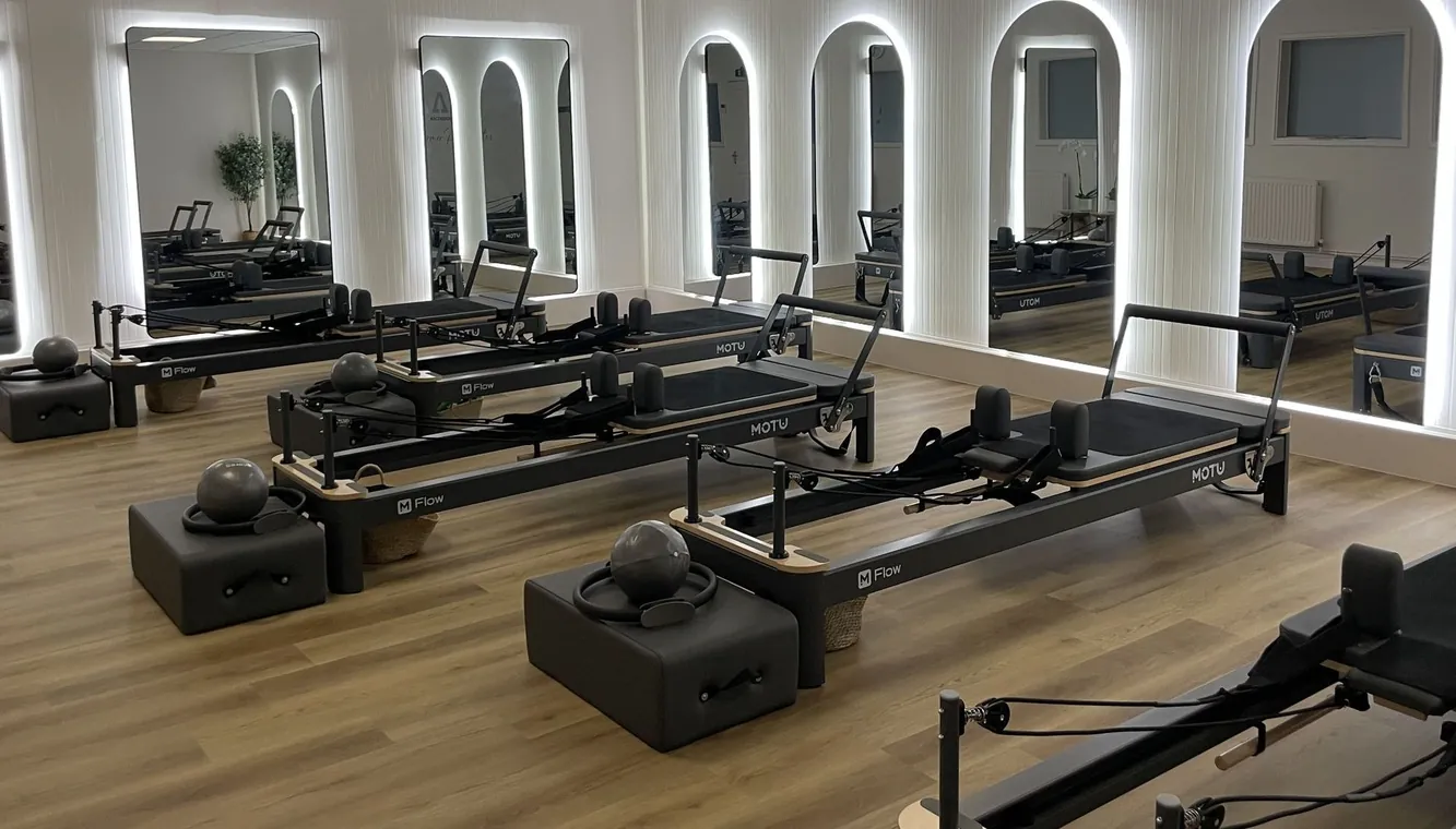 Wide view of the Ascension Reformer Pilates studio floor
